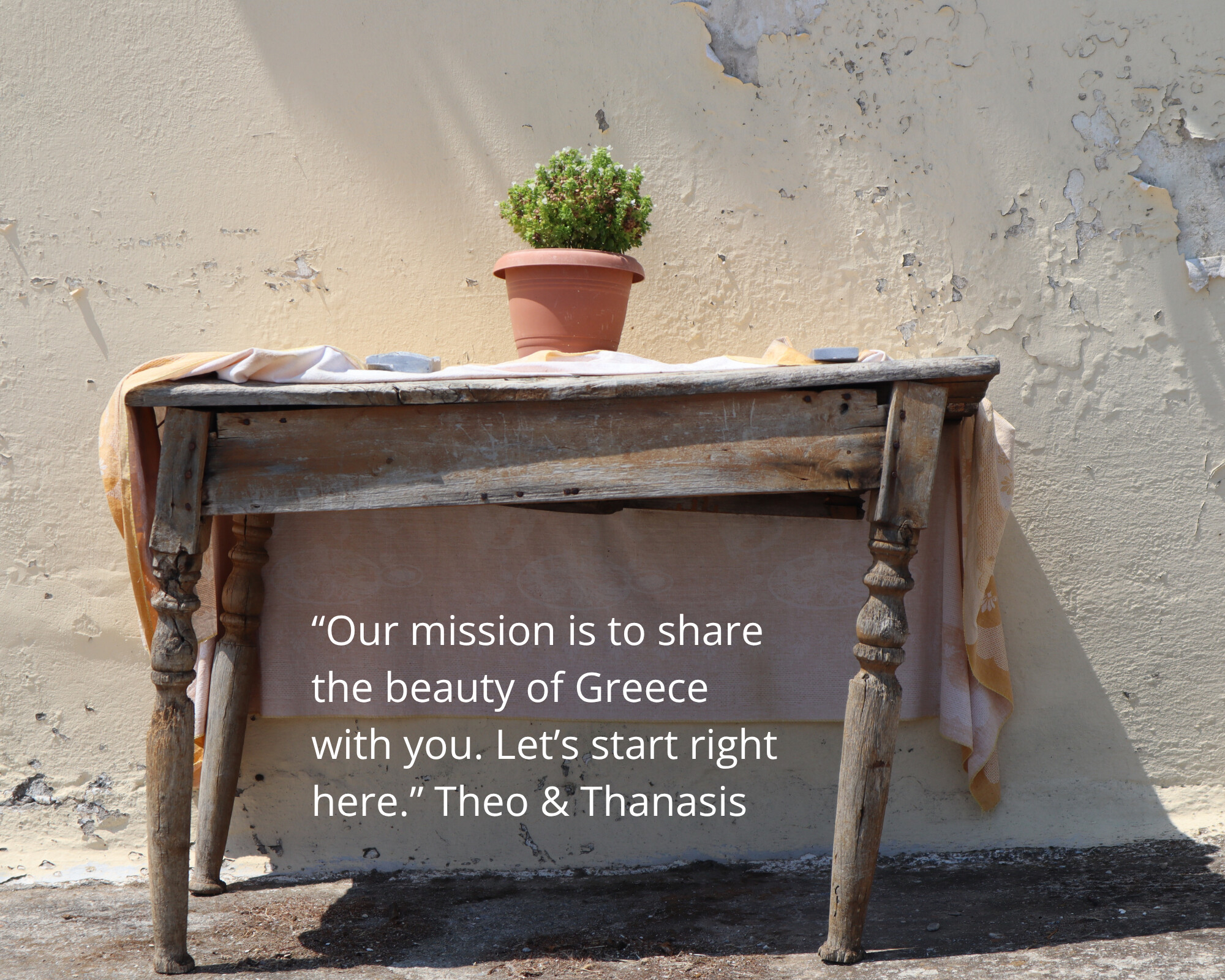 “Our mission is to share the beauty of Greece with you. Let’s start right here.” - a rustic table and potted plant in the Greek sun, Monobrow Holidays Greece